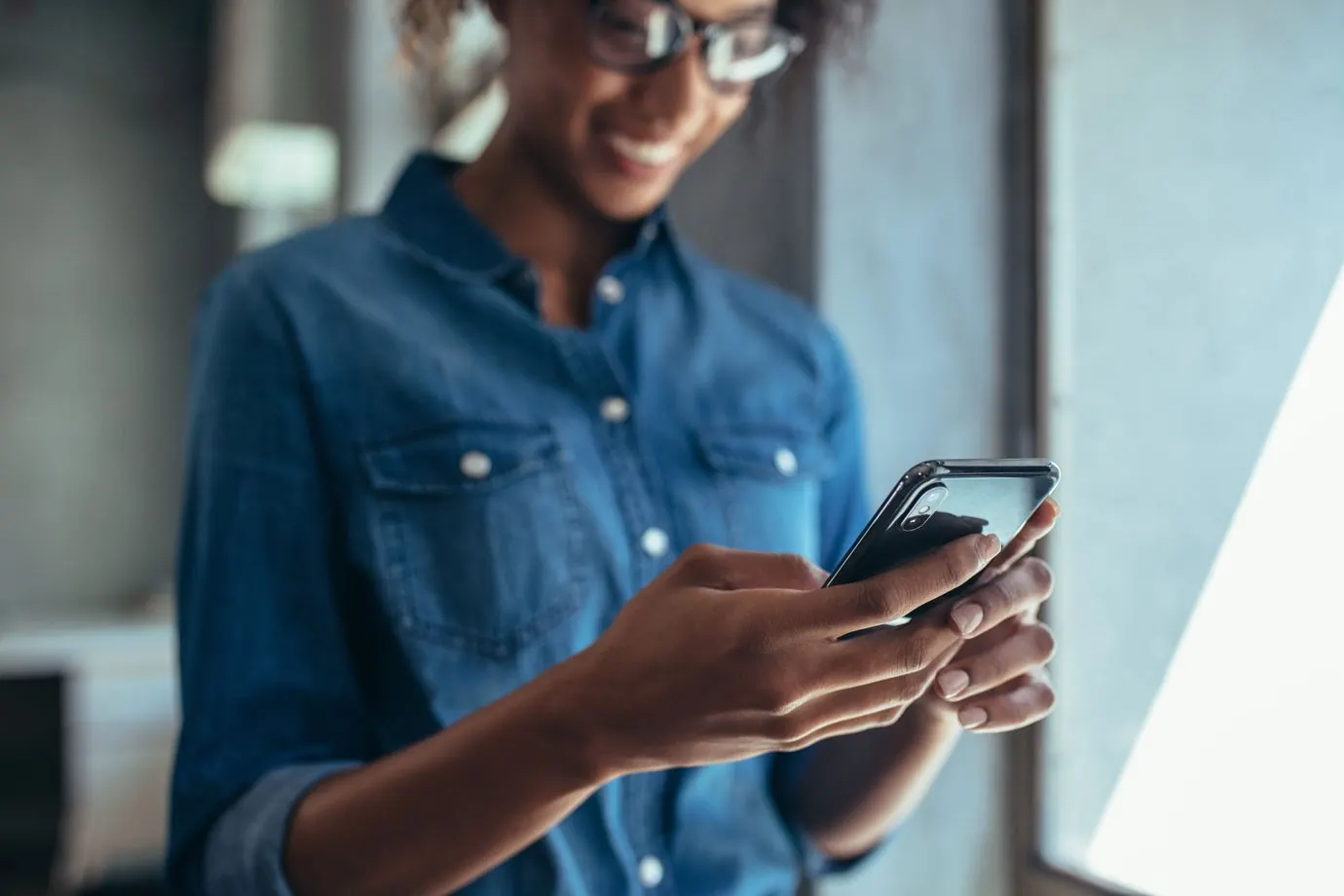 A woman holding a iphone communicating with a chatbot