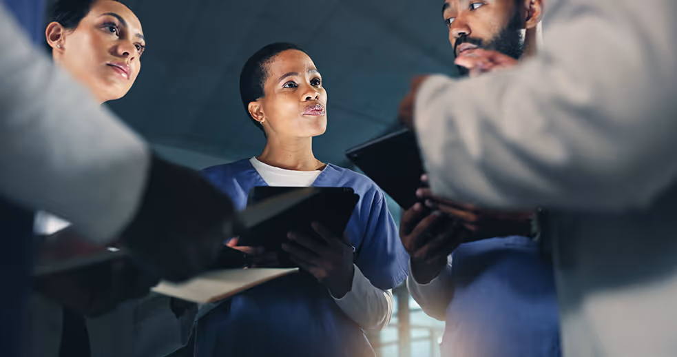 Image of a care team being trained on communicating securely with a HIPAA-Compliant messaging app.